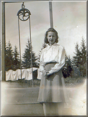 Ida Martha Girt standing by a well